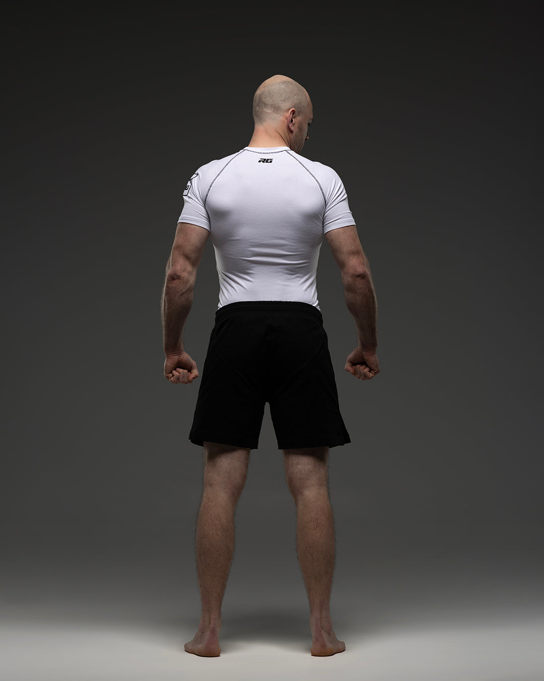White RG NaturaFlex™ rash guard by Rolling-Giants, short sleeve, snug fit, made of stretchy athletic fabric, designed for active sports.