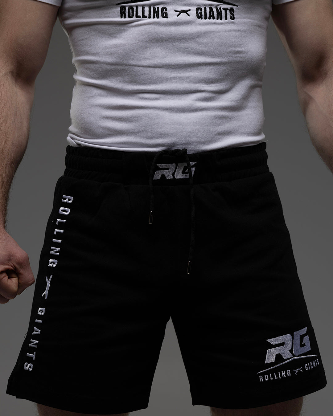 Black RG Fight Shorts by Rolling-Giants with adjustable waistband and reinforced stitching, designed for MMA and combat sports.
