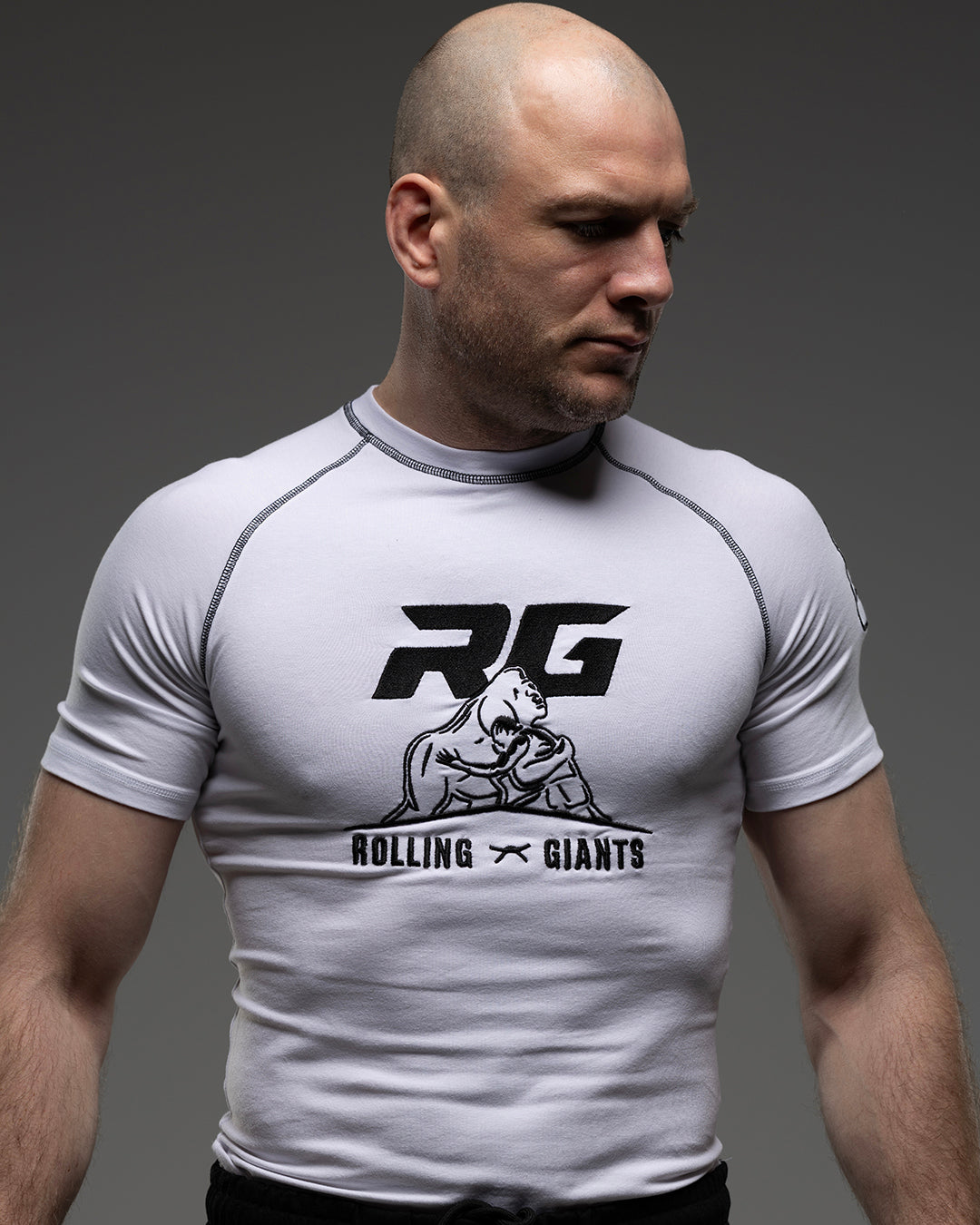 White RG NaturaFlex™ rash guard by Rolling-Giants, short sleeve, stretchy athletic swimwear with logo details.