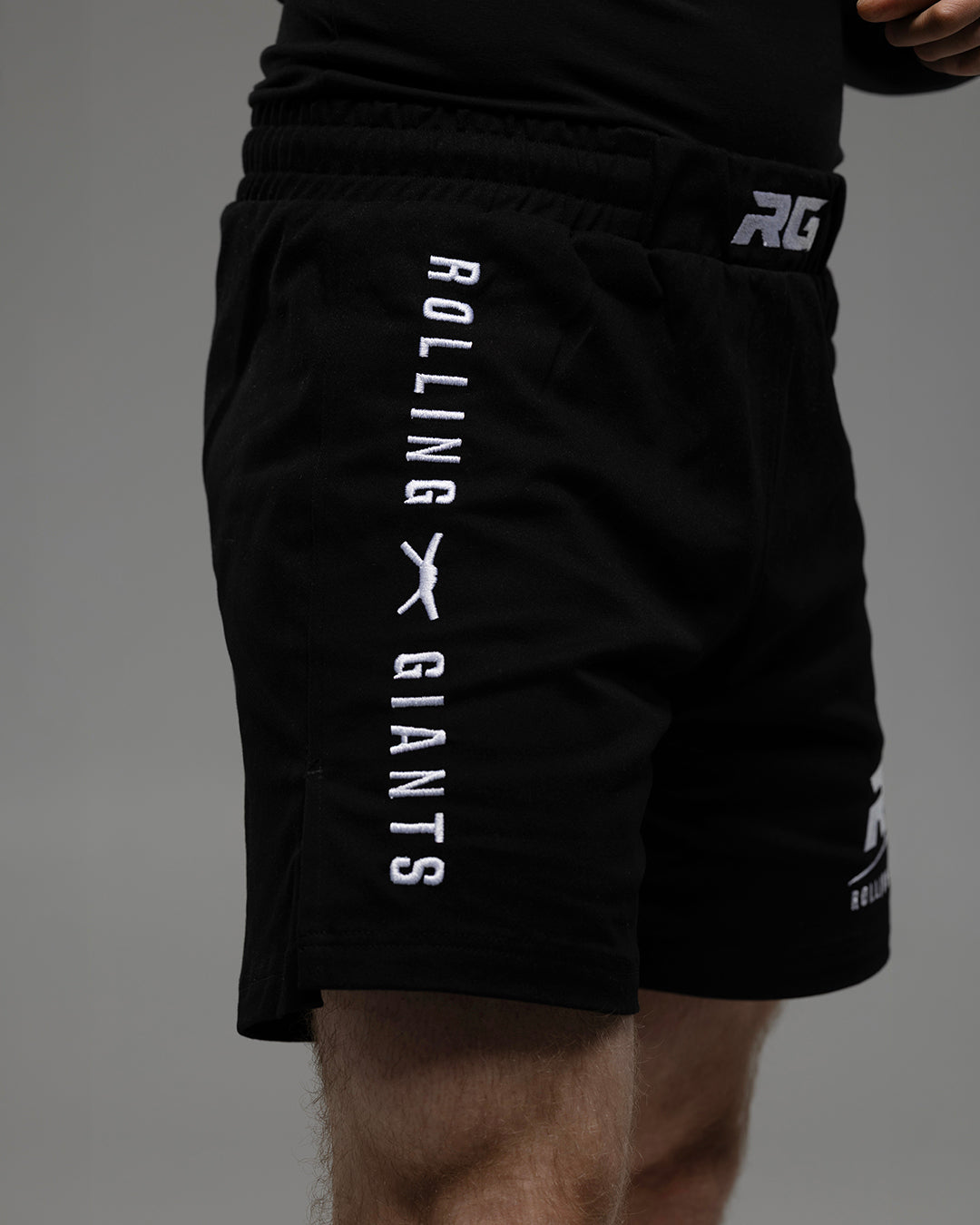 Black RG Fight Shorts by Rolling-Giants, featuring durable fabric and adjustable waistband for martial arts training and competition.