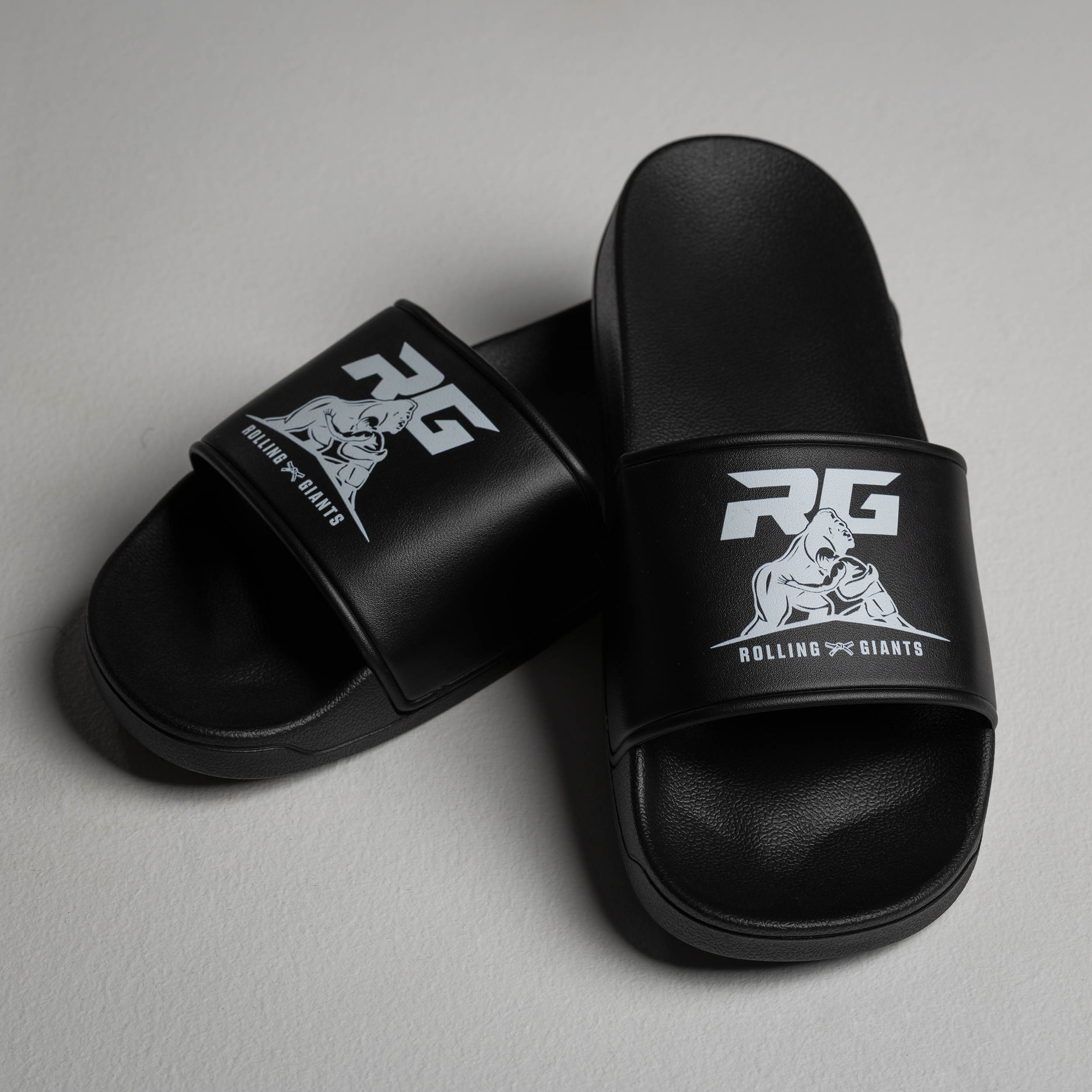 Black RG Gym Sliders by Rolling-Giants, showing a pair of fitness sliders on a white background.